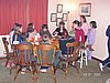 Teenagers eating pancakes around a table